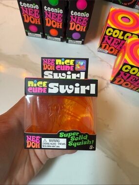 NeeDoh Nice Cube Swirl - Orange Clear Squish Toy